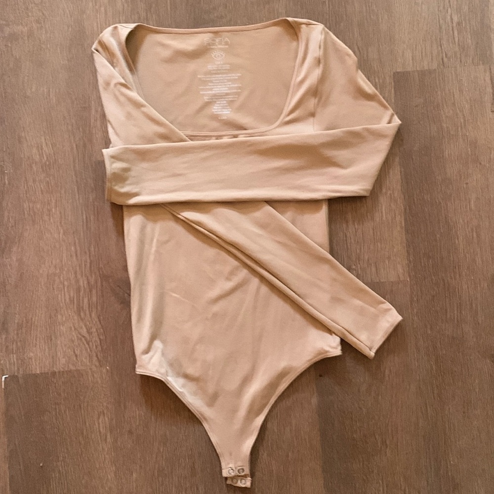 Tan shape wear body suit with thing button closure. Size small